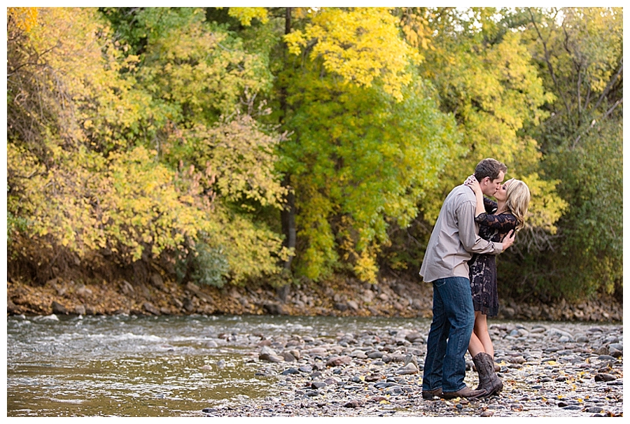 Kissing on a creek in the fall
