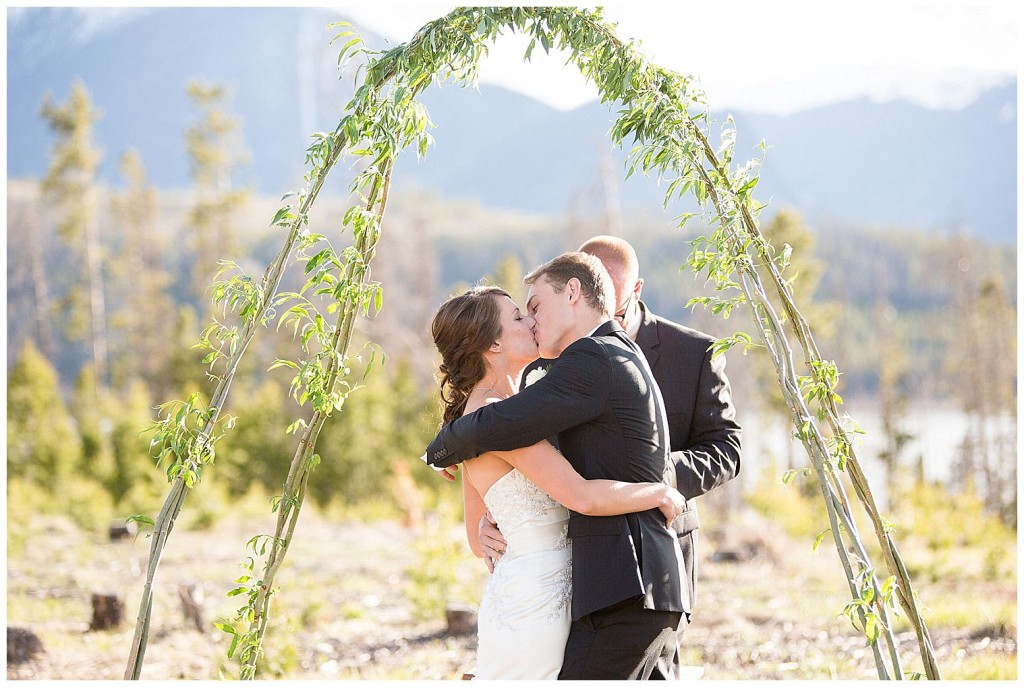 Bride and groom's first kiss at their Lake Dillon wedding